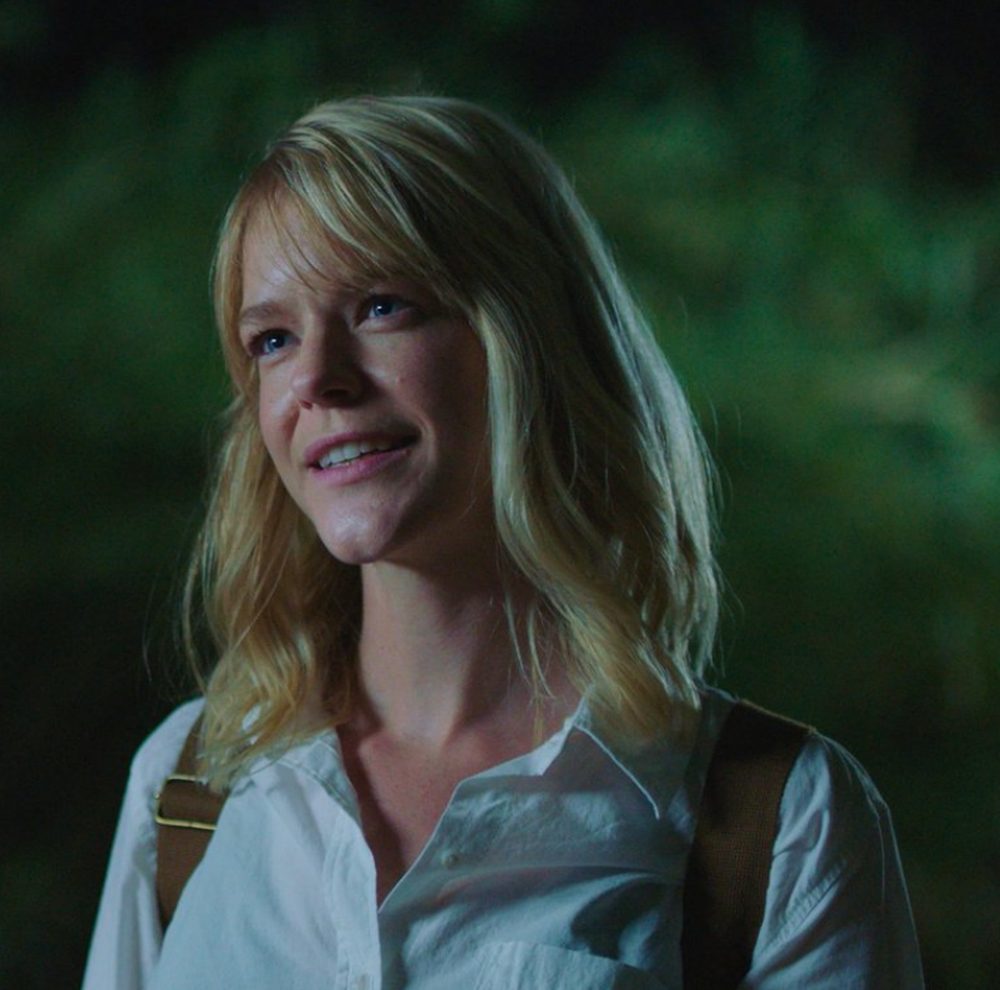 Claire in a white shirt at night